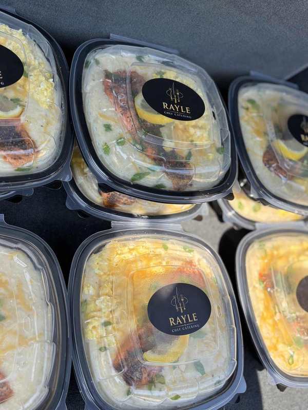Assorted individually packaged Charelli’s meals arranged for a group order
